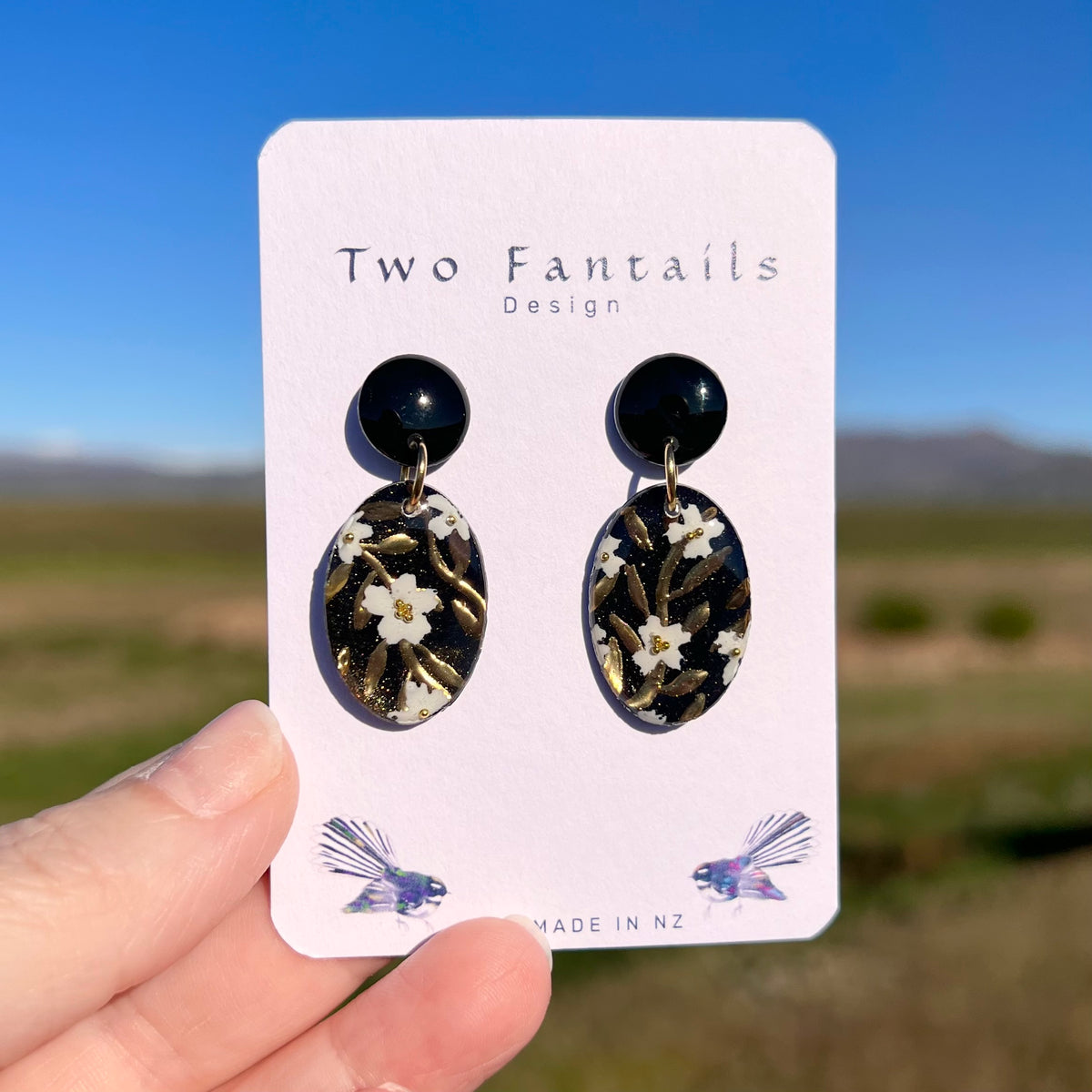Midnight in Bloom – Black, White & Gold Floral Dangle Earrings