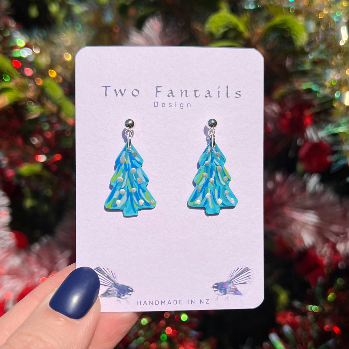 Hand-painted turquoise Christmas tree drops with blue and green strokes and silver dots