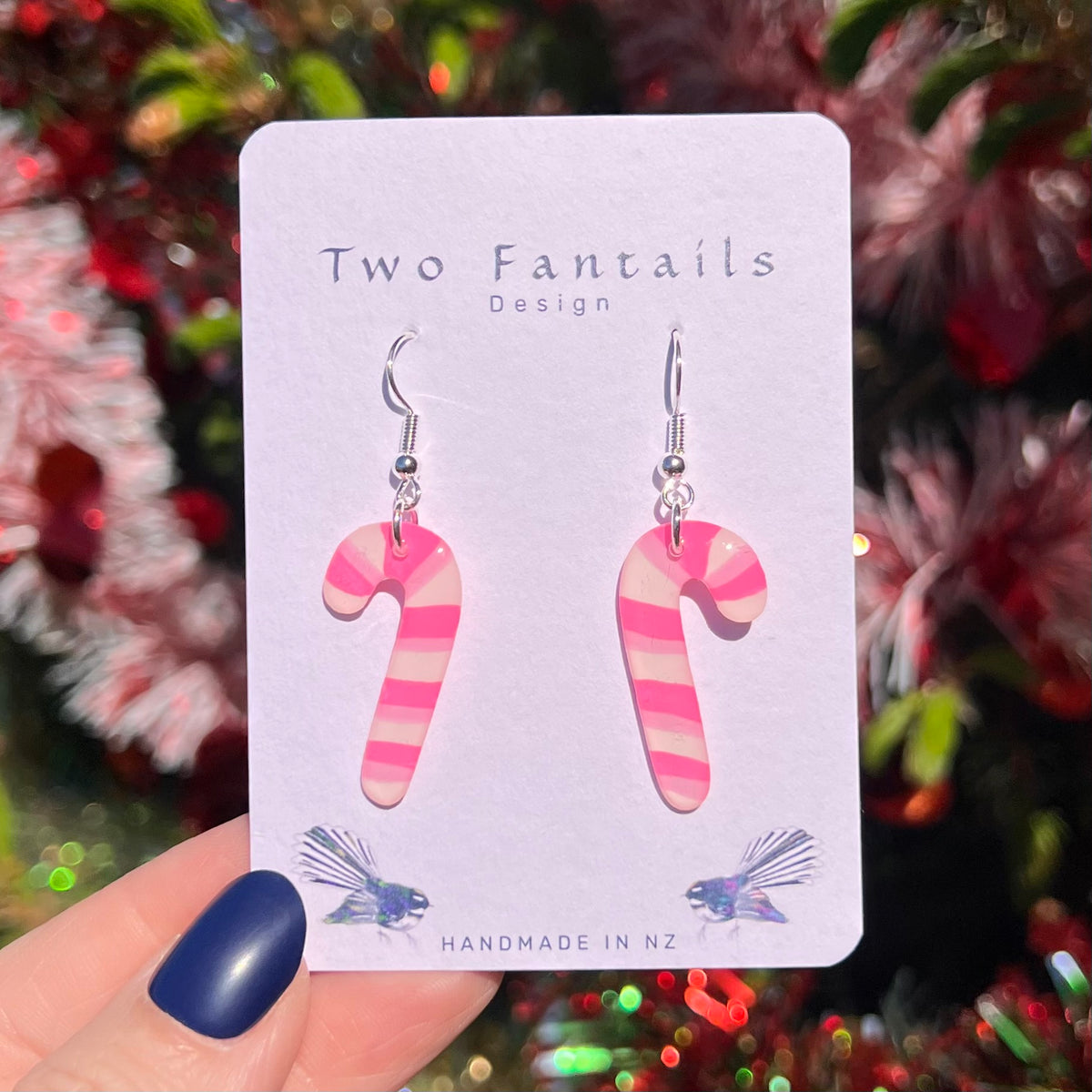 Pink and pale blush striped candy cane earrings with silver-tone hooks