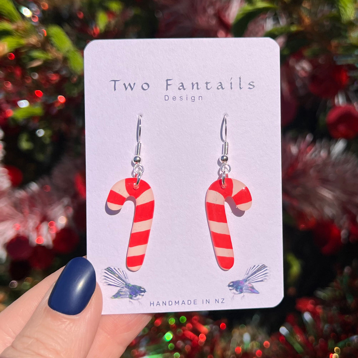 Classic red and white striped candy cane earrings with silver-tone hooks