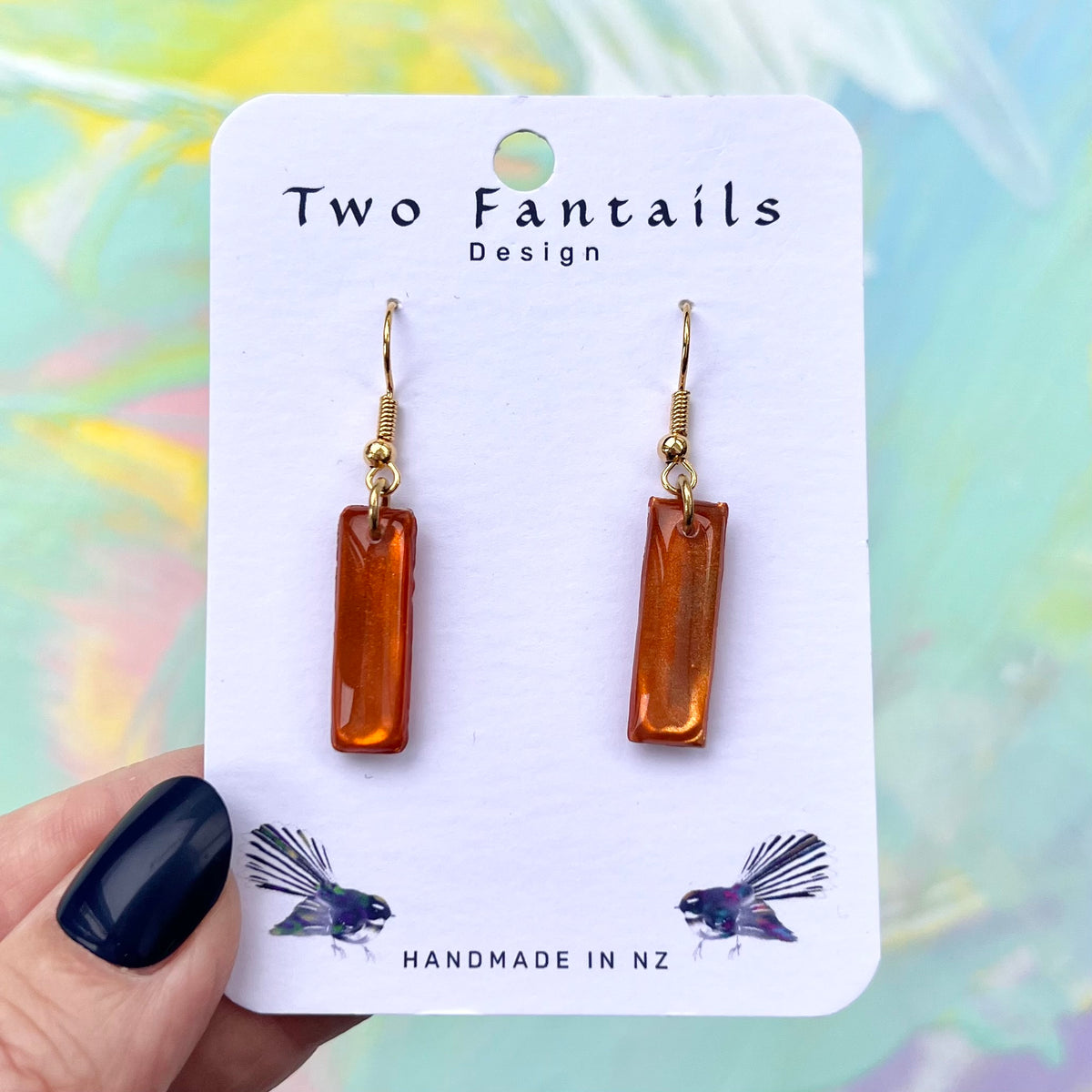 Glossy metallic burnt orange copper rectangular dangle earrings with gold-tone hooks