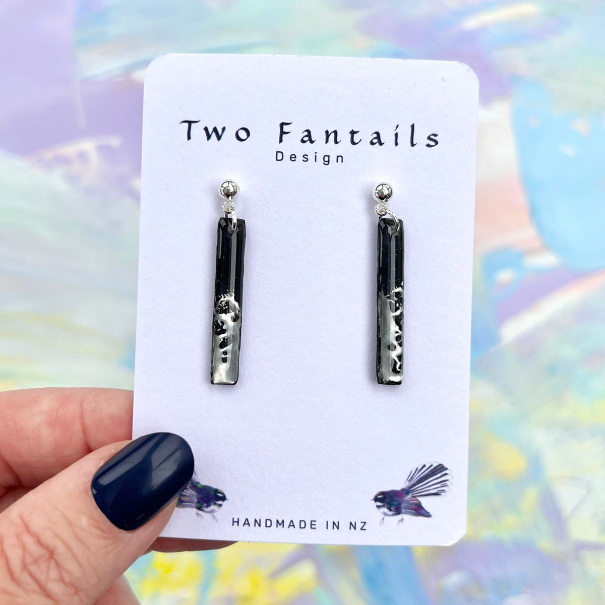 Black slim rectangular earrings with metallic silver splashes and silver-tone ball studs