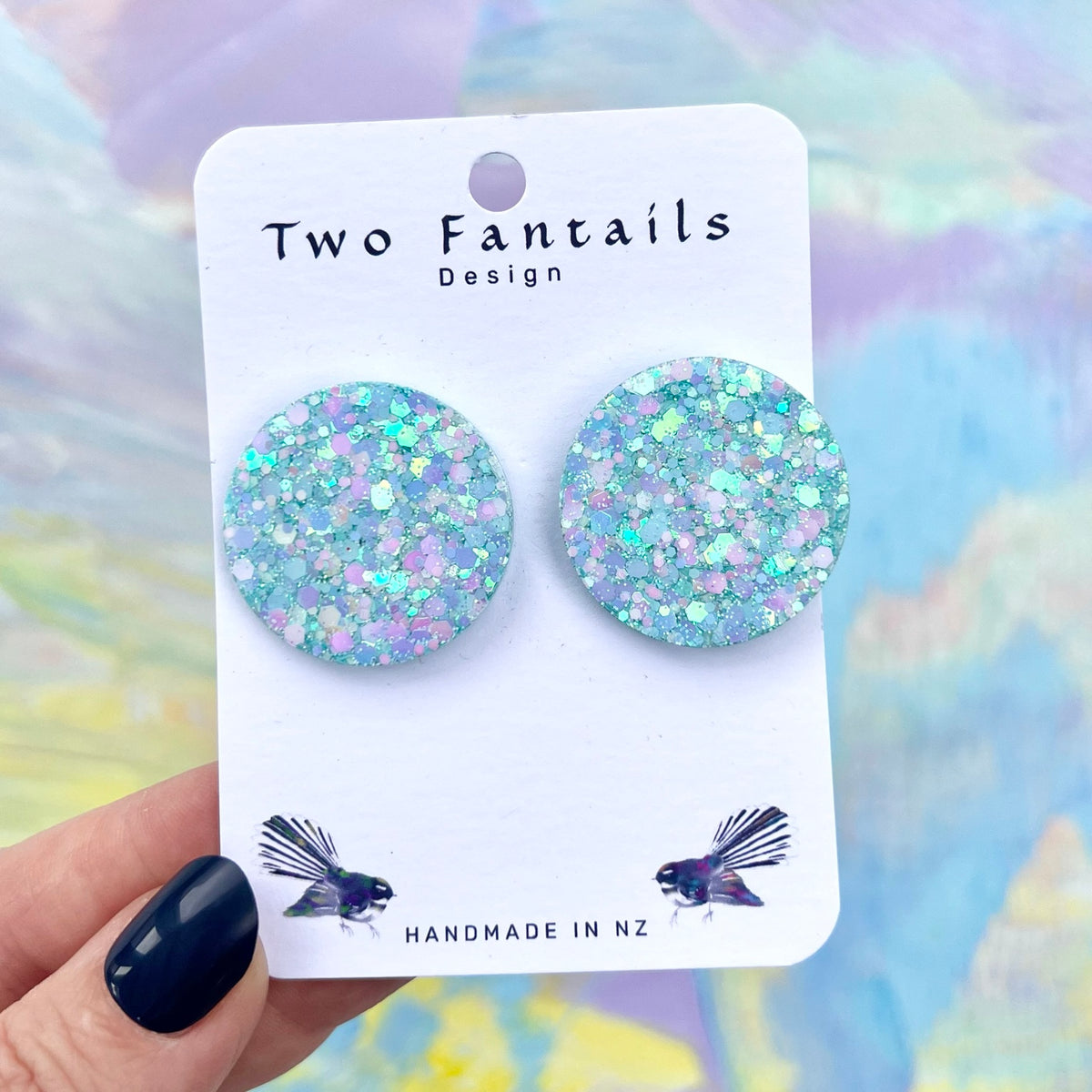 Large round pastel aqua lilac and pink glitter statement stud earrings on Two Fantails Design card