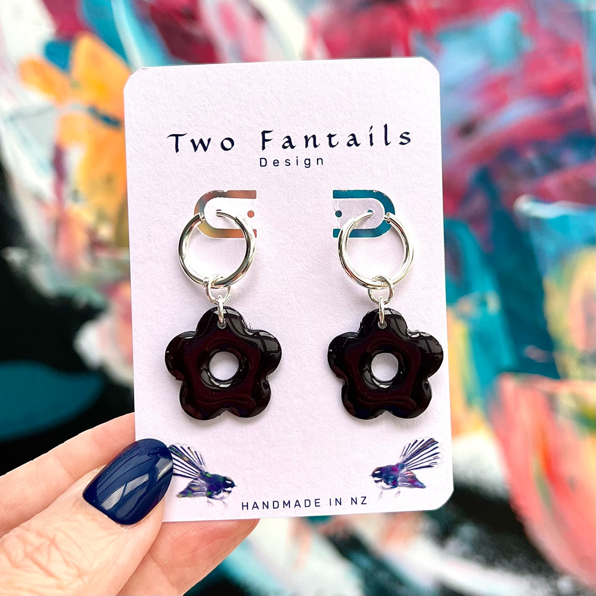 Midnight Bloom black flower charm dangle earrings with silver-tone hoops