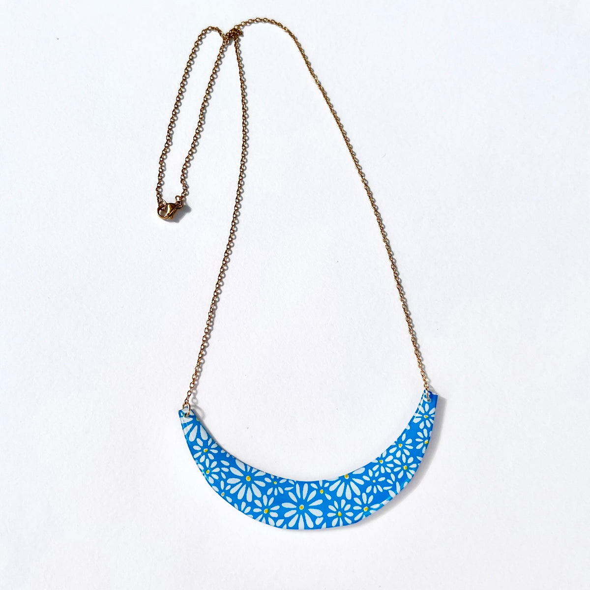 Full Daisy Days blue floral crescent statement necklace with gold-tone chain