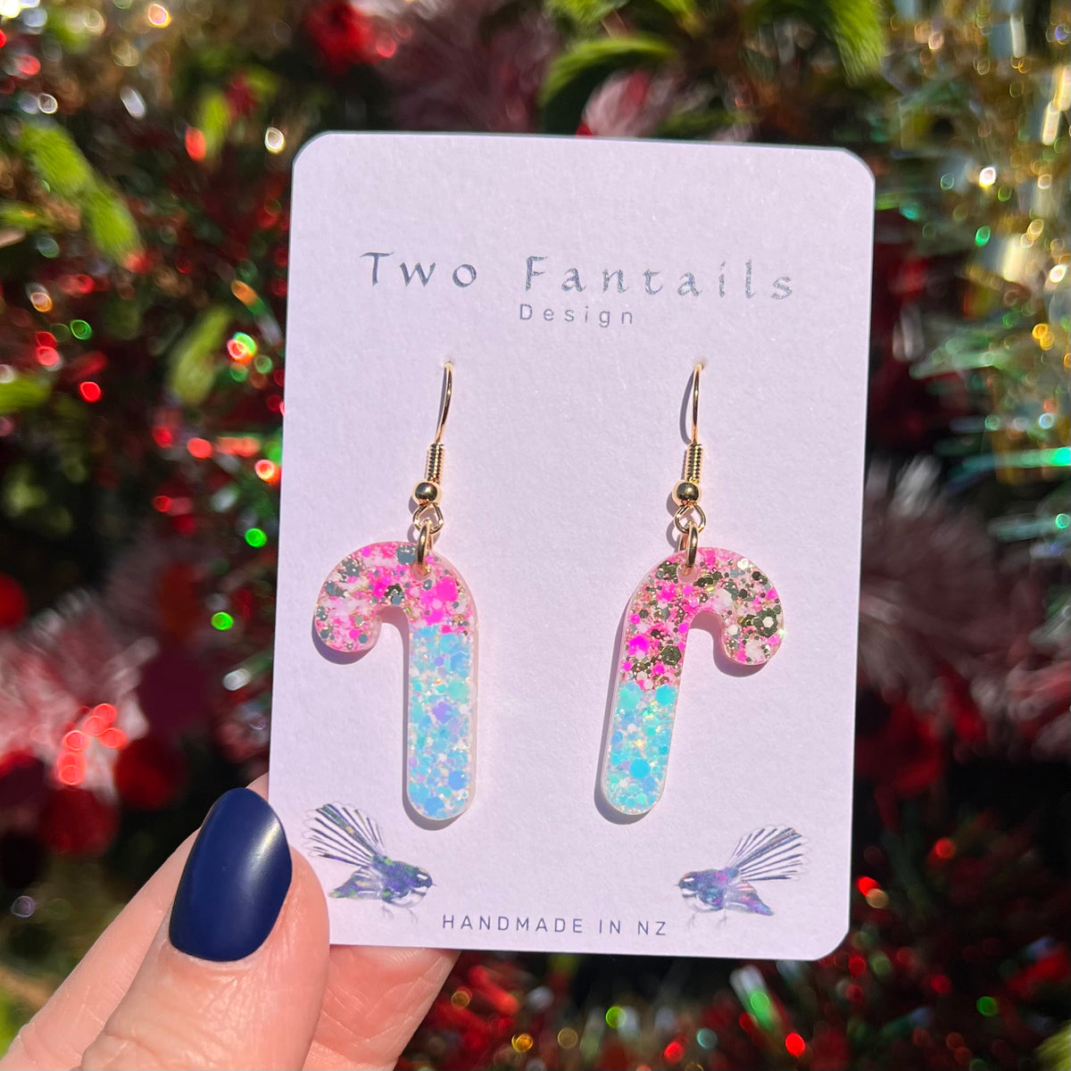 Candy cane earrings with playful pink and turquoise confetti glitter