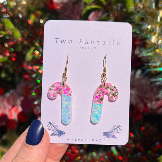 Candy cane earrings with playful pink and turquoise confetti glitter