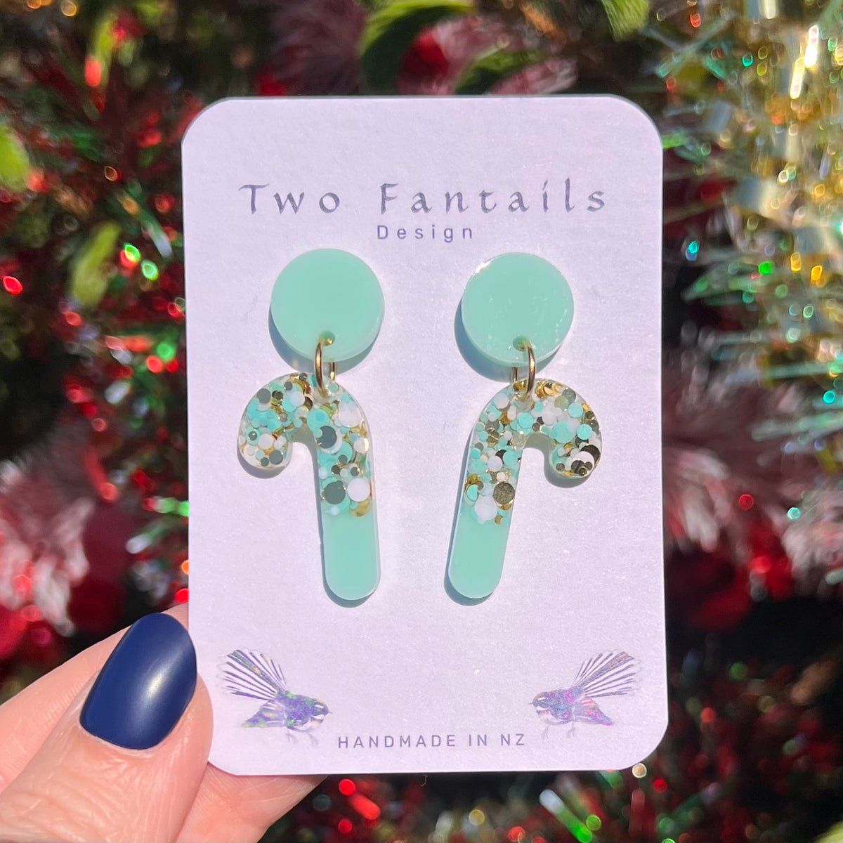 Mint green round studs with coordinating mint candy cane drops sprinkled with white, gold and mint confetti