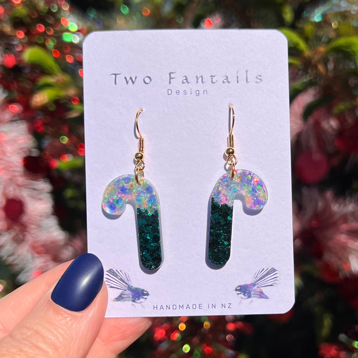 Deep emerald glitter candy canes with shimmering iridescent icy tops and gold-tone hooks
