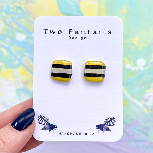 Second hand-painted pair of Licorice Allsort Yellow square studs, with slightly different stripe placement