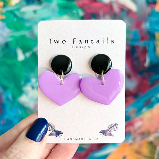 Love at First Lilac handmade dangle earrings with glossy black round studs and pastel lilac heart-shaped drops, by Two Fantails Design New Zealand.