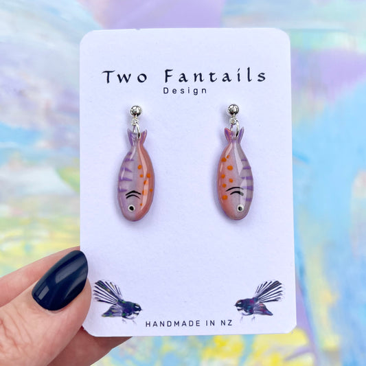 Pastel pink and lilac hand-painted fish earrings with orange spots and silver-tone stud findings