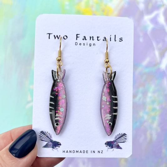 Pink glitter and black sardine fish-shaped earrings with gold-tone hooks