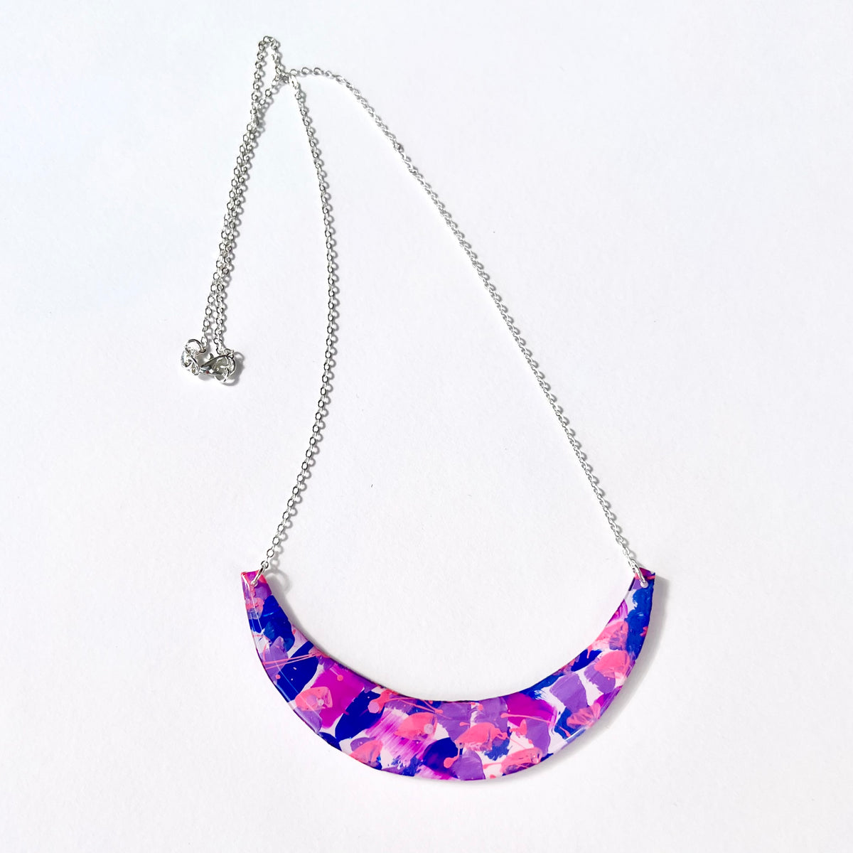 Pink purple and blue abstract crescent statement necklace with silver-tone chain