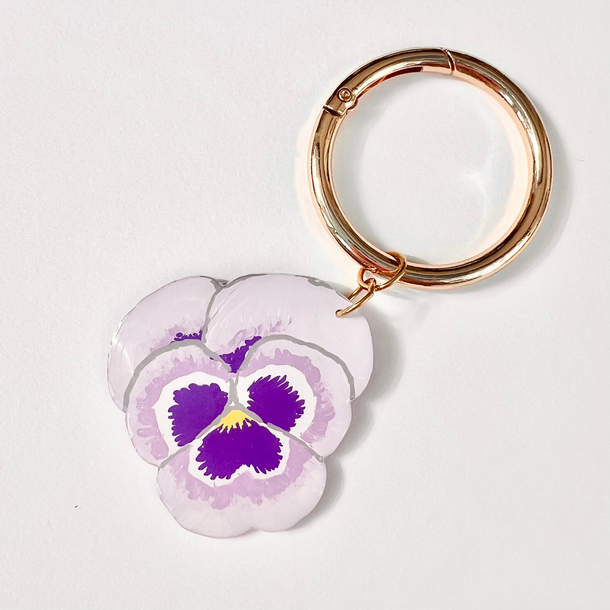 Lavender and purple hand-painted pansy statement keyring