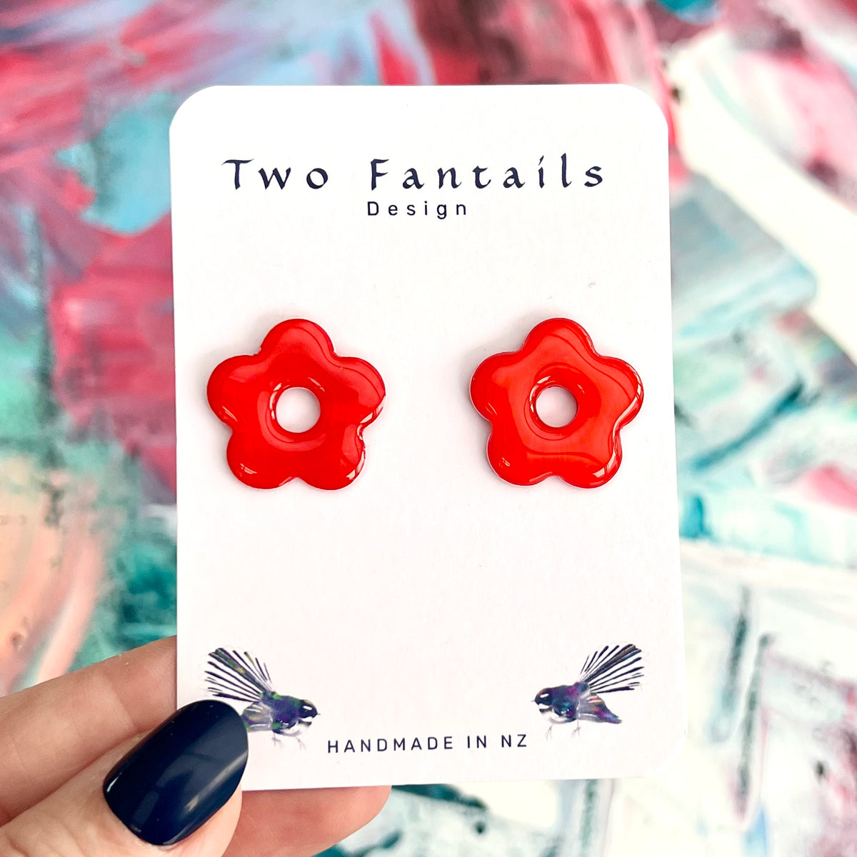 Glossy red flower stud earrings on Two Fantails Design card