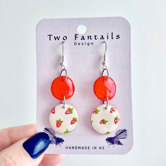 Scarlet red round top and white strawberry pattern dangle earrings on Two Fantails Design card