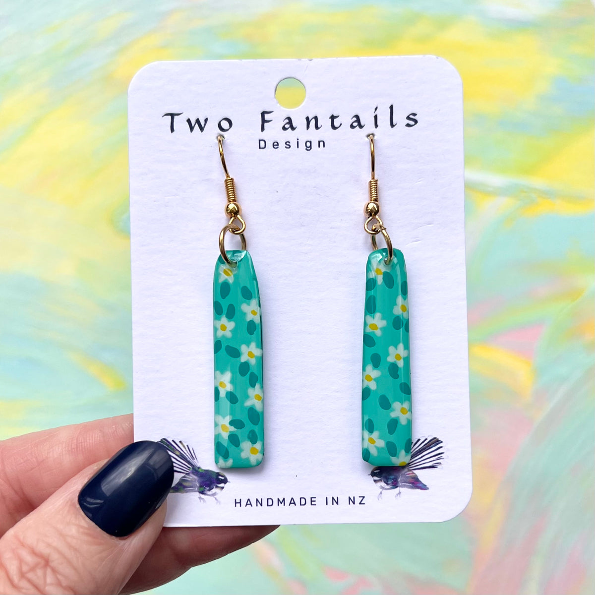 Turquoise daisy earrings with gold-tone hooks