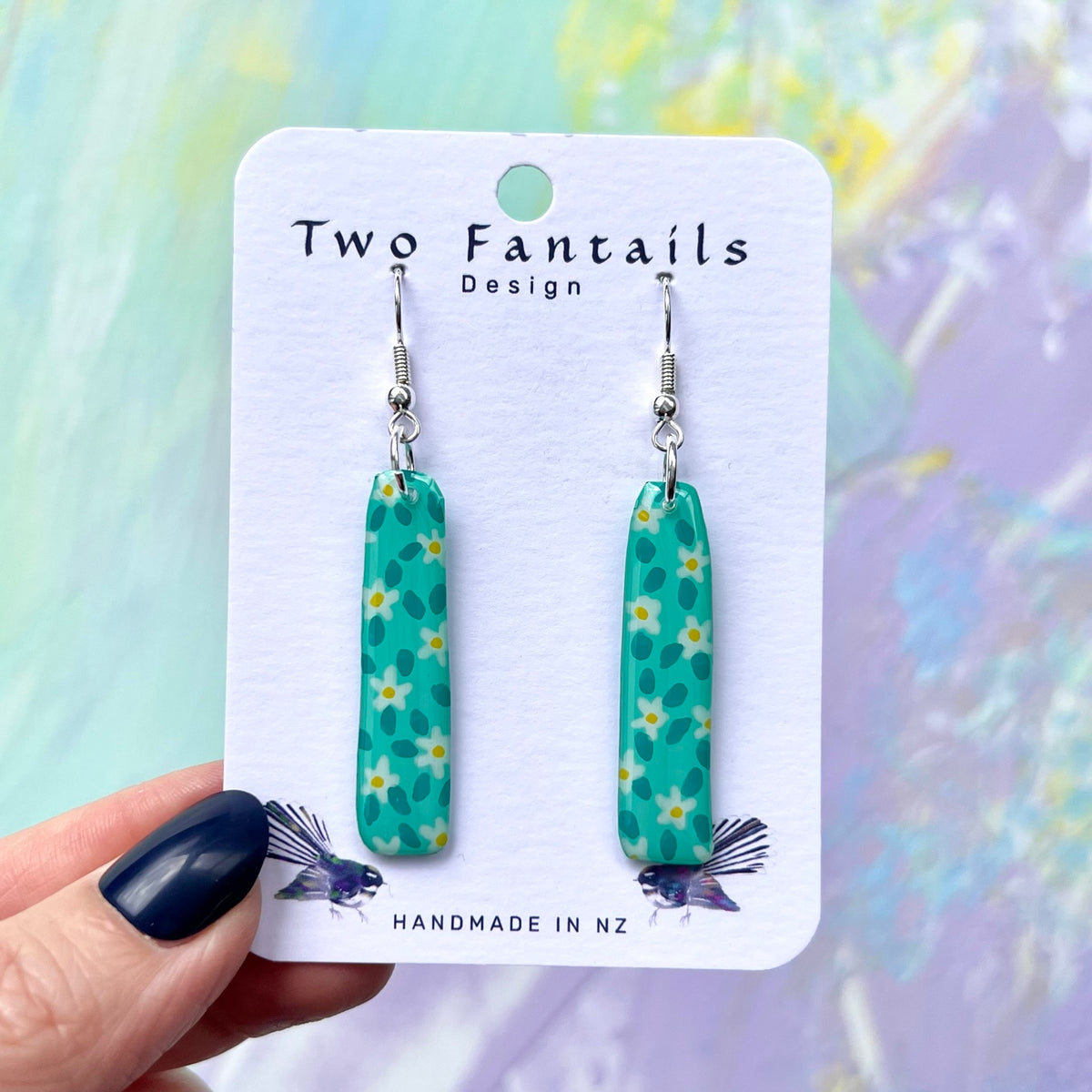 Turquoise daisy earrings with silver-tone hooks