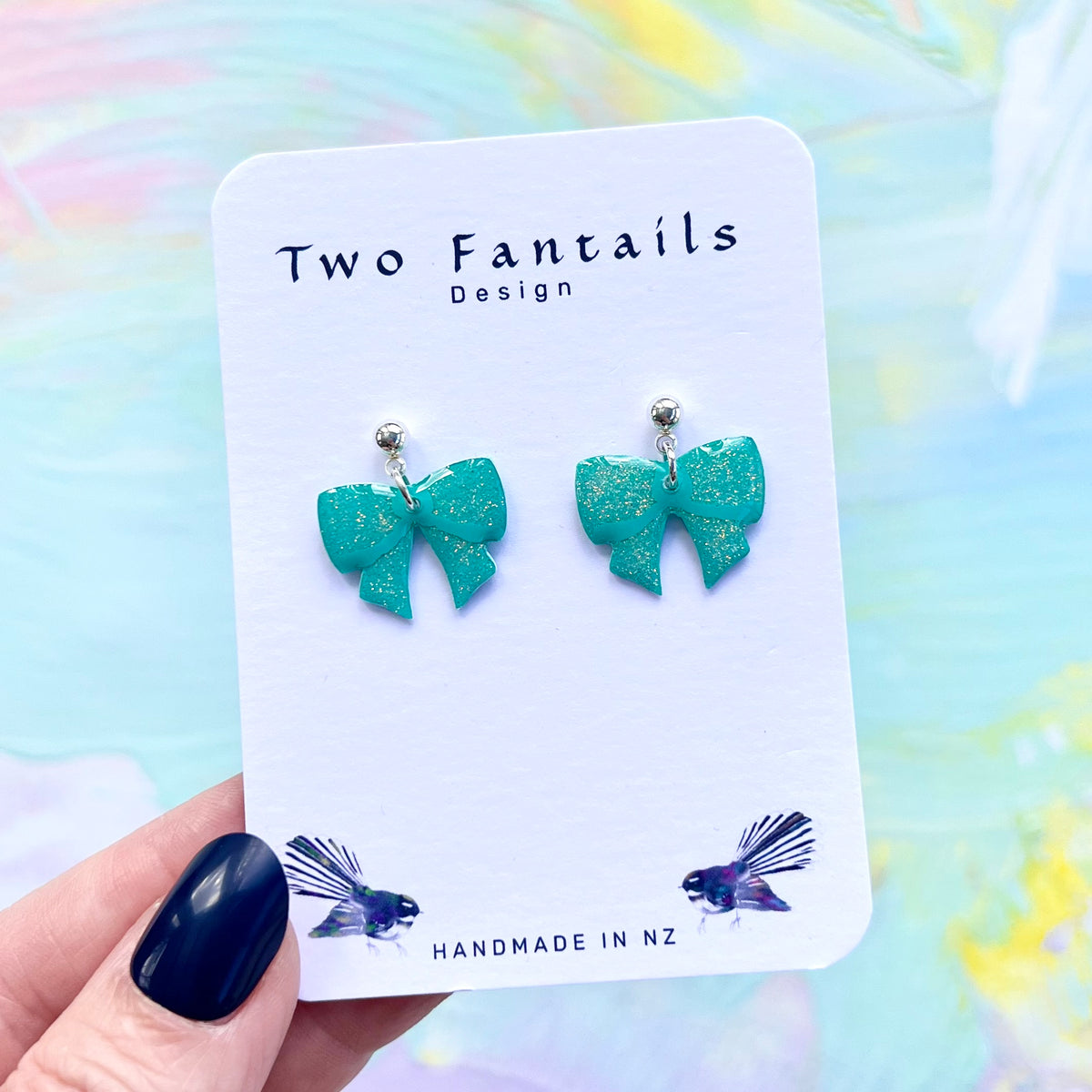 Turquoise glitter bow dangle earrings with silver ball studs