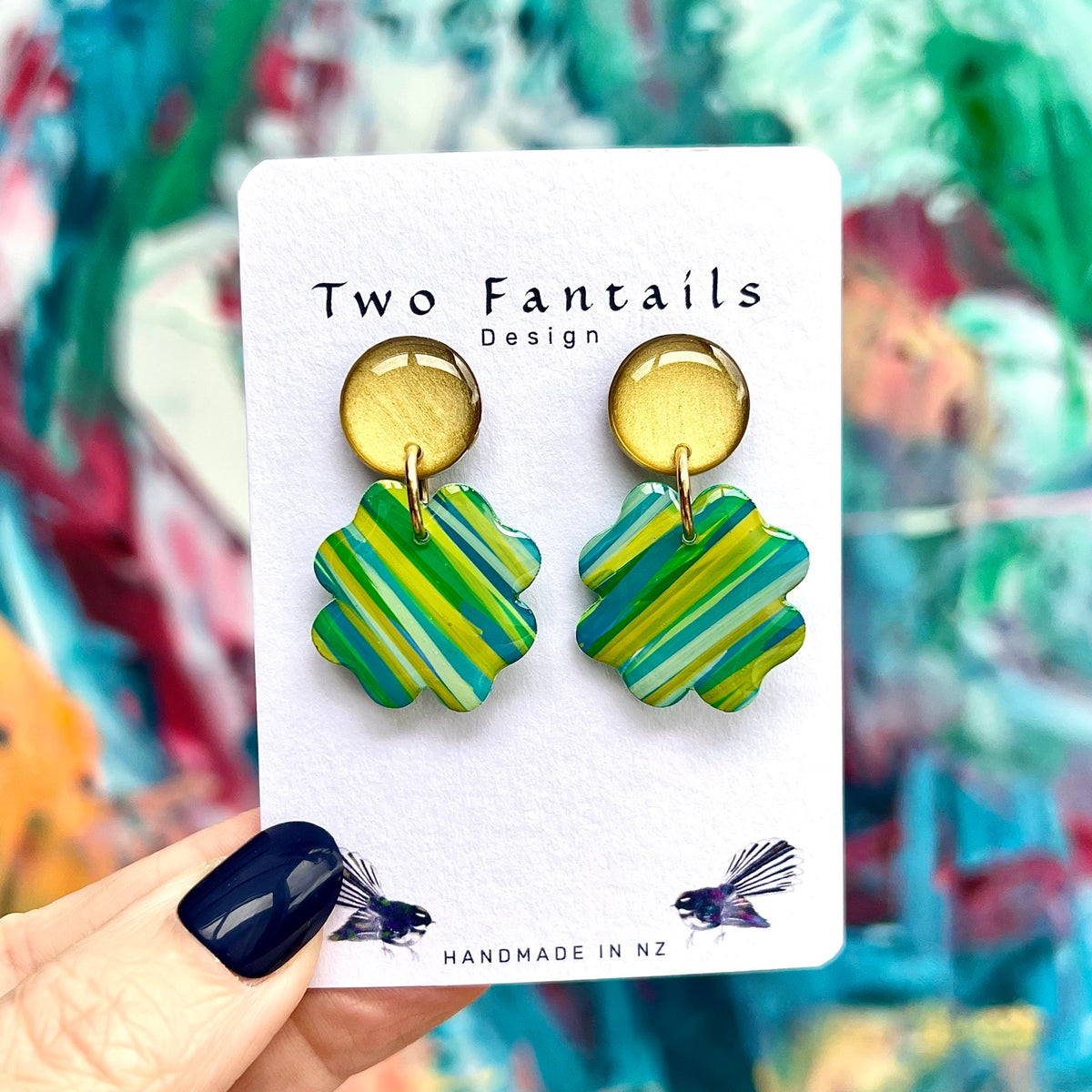 Golden Hour gold stud earrings with green blue and yellow striped scalloped flower dangles