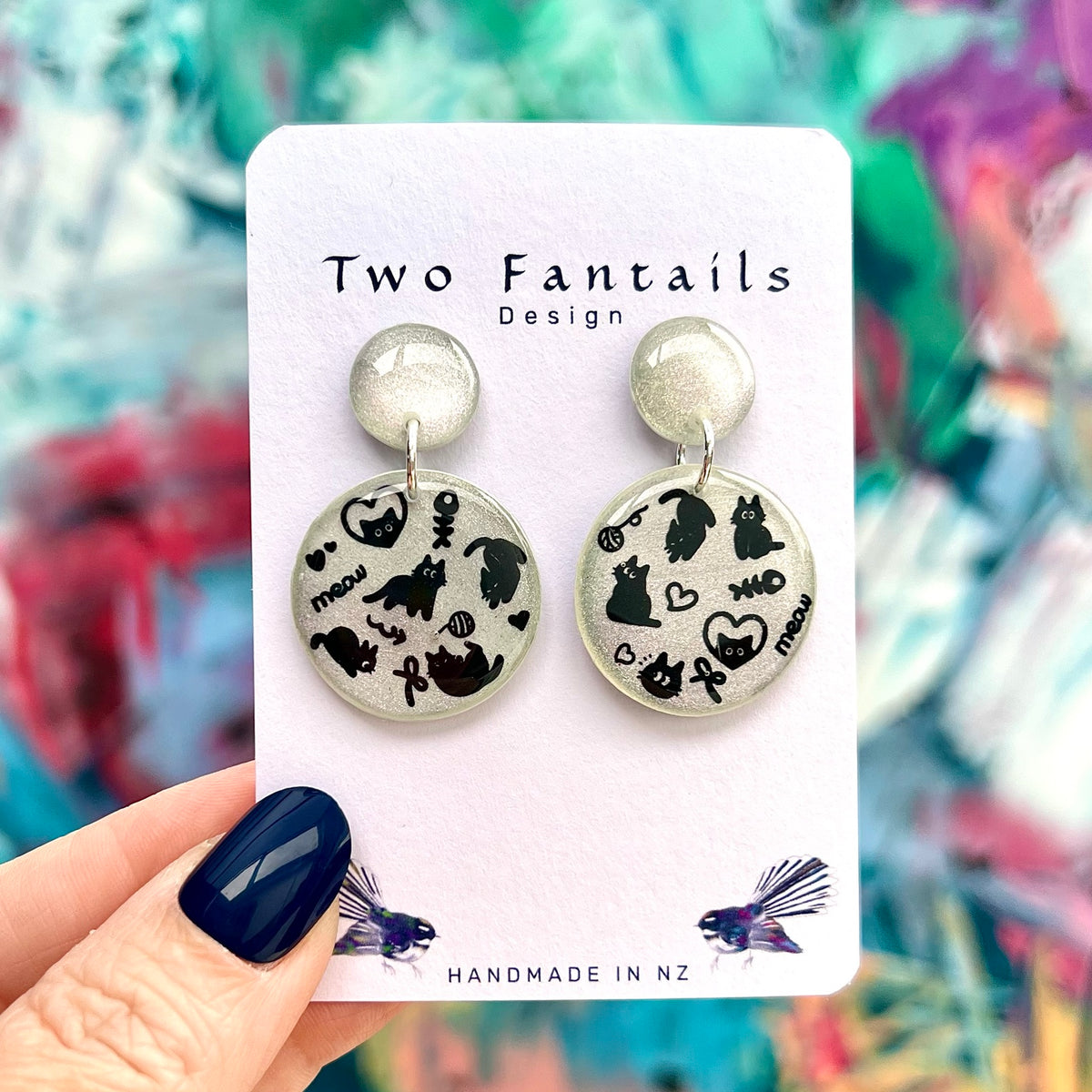 Meow Magic silver shimmer earrings with black cat doodles